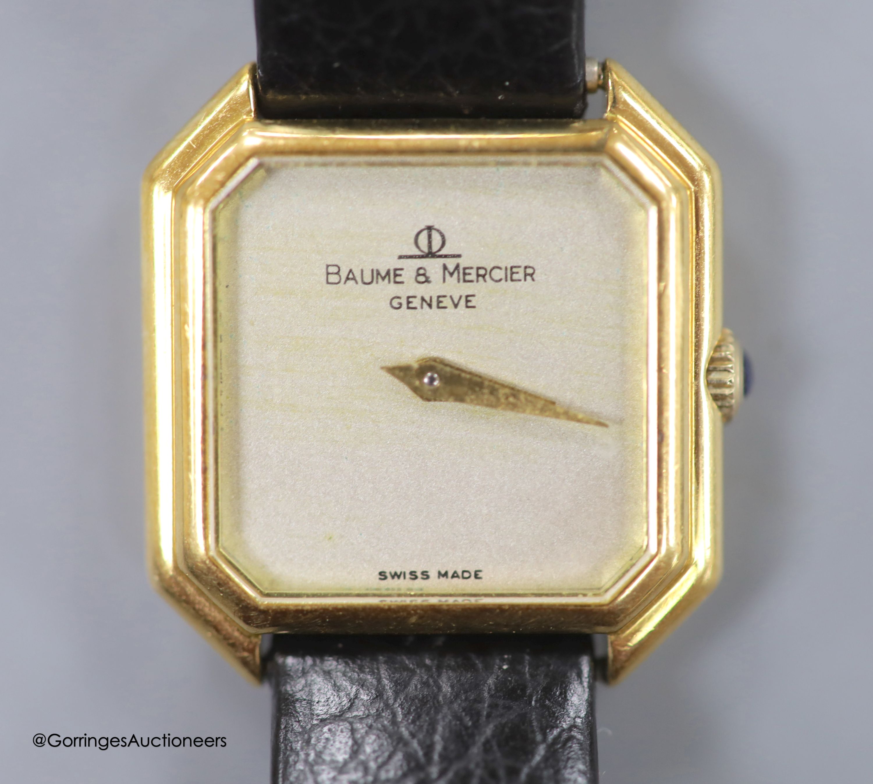 A lady's 18ct gold Baume & Mercier manual wing octagonal dial wrist watch, on associated leather strap
